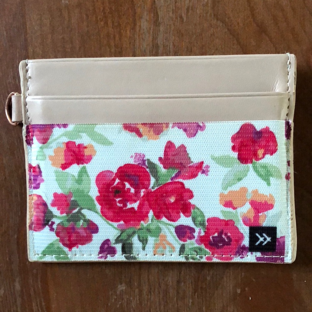 Cute floral and light pink thread wallet.